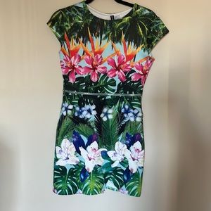 Small tropical/floral mini dress with zipper detail and asymmetrical hem